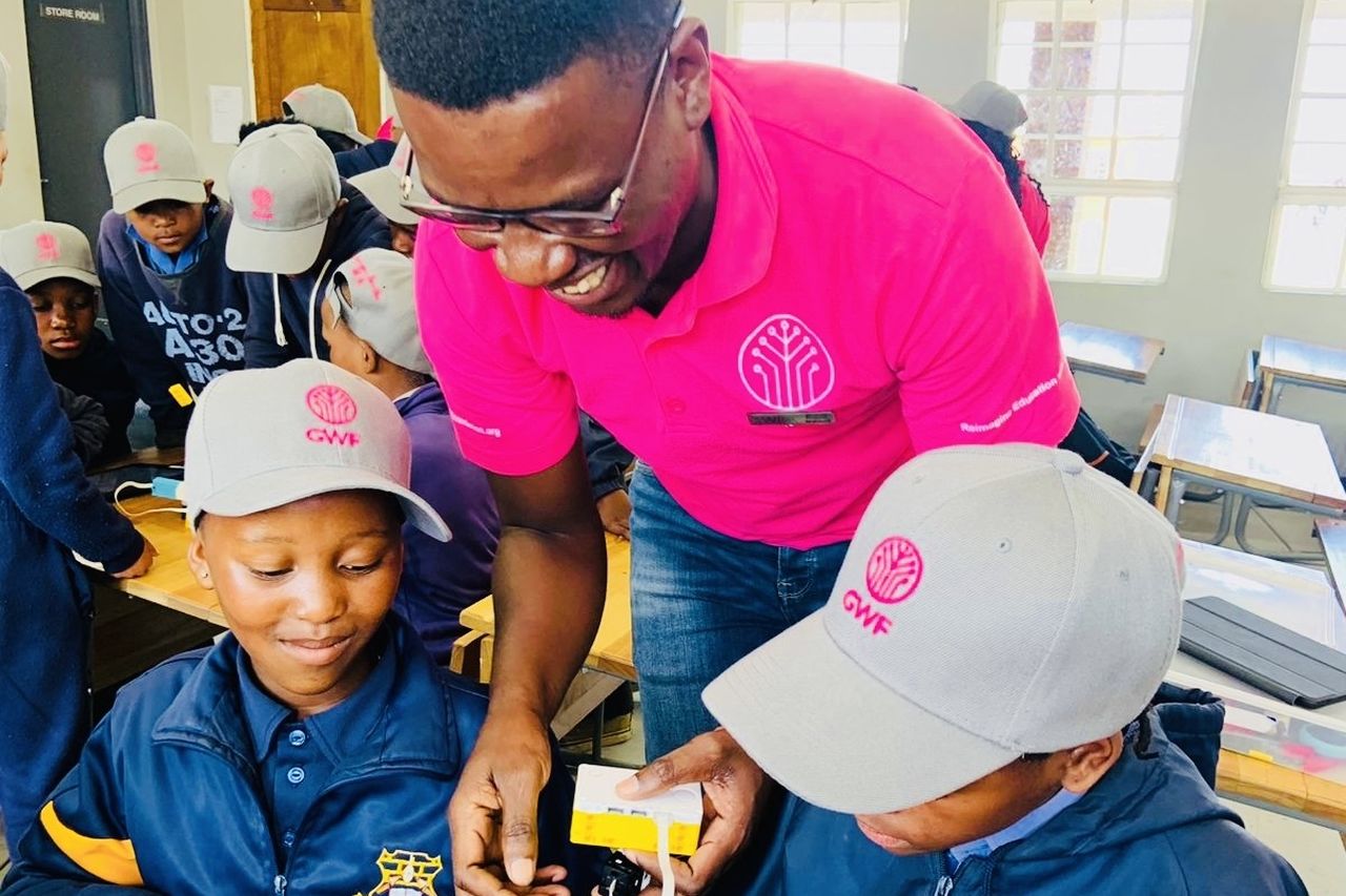 Arnold gives a demonstration to pupils learning robotics