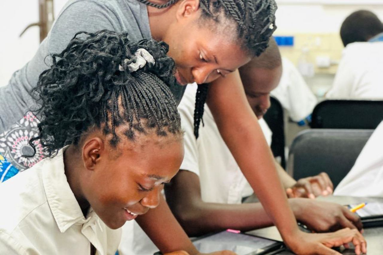 Jane assists students with their robotics and coding