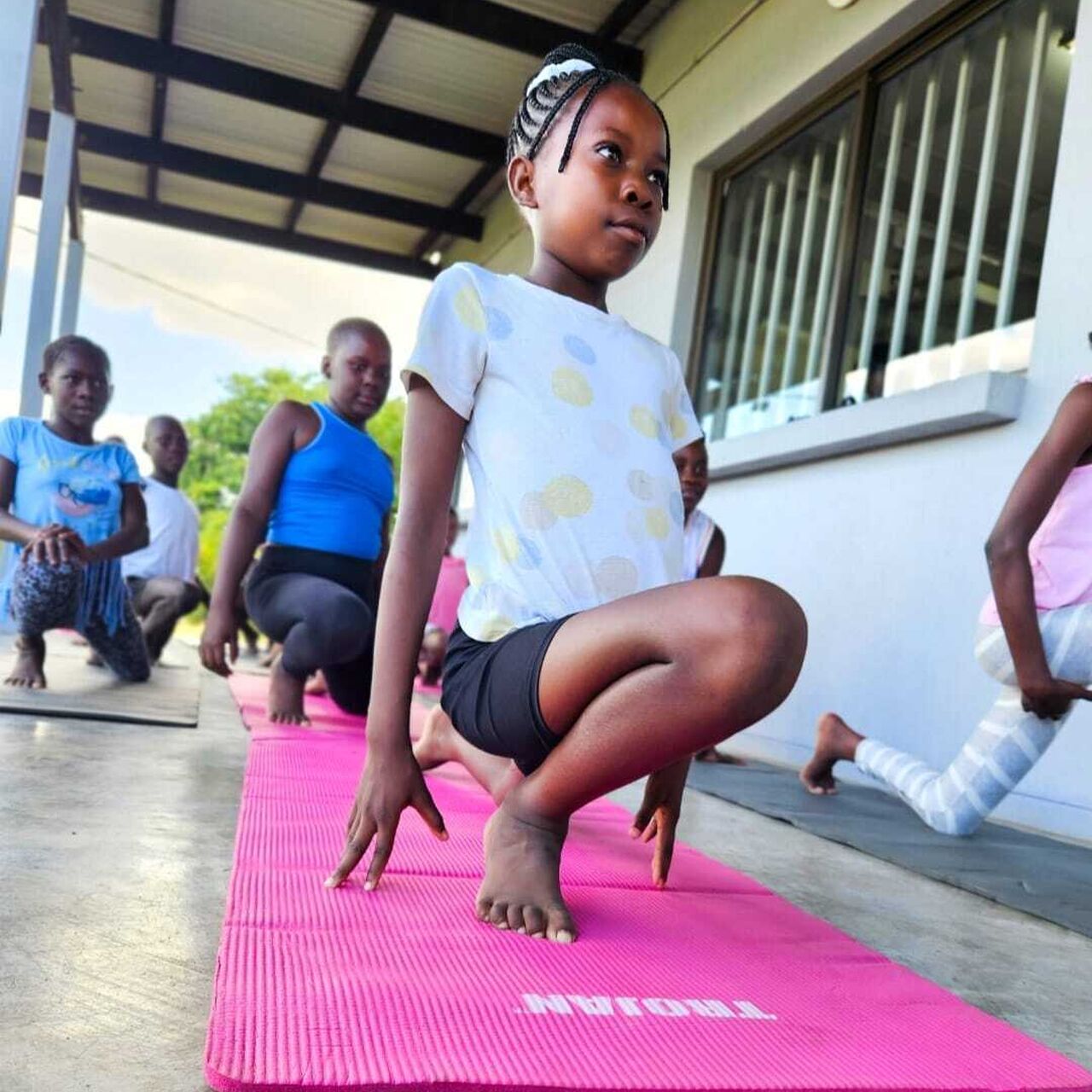 Children practise yoga at GWF
