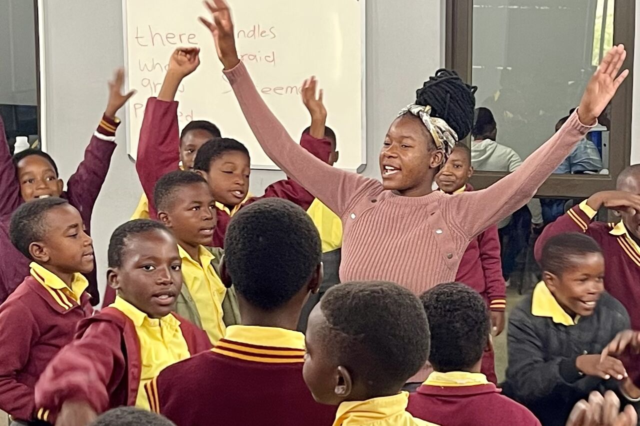GWF facilitator leading learners in dancing and stretching exercises