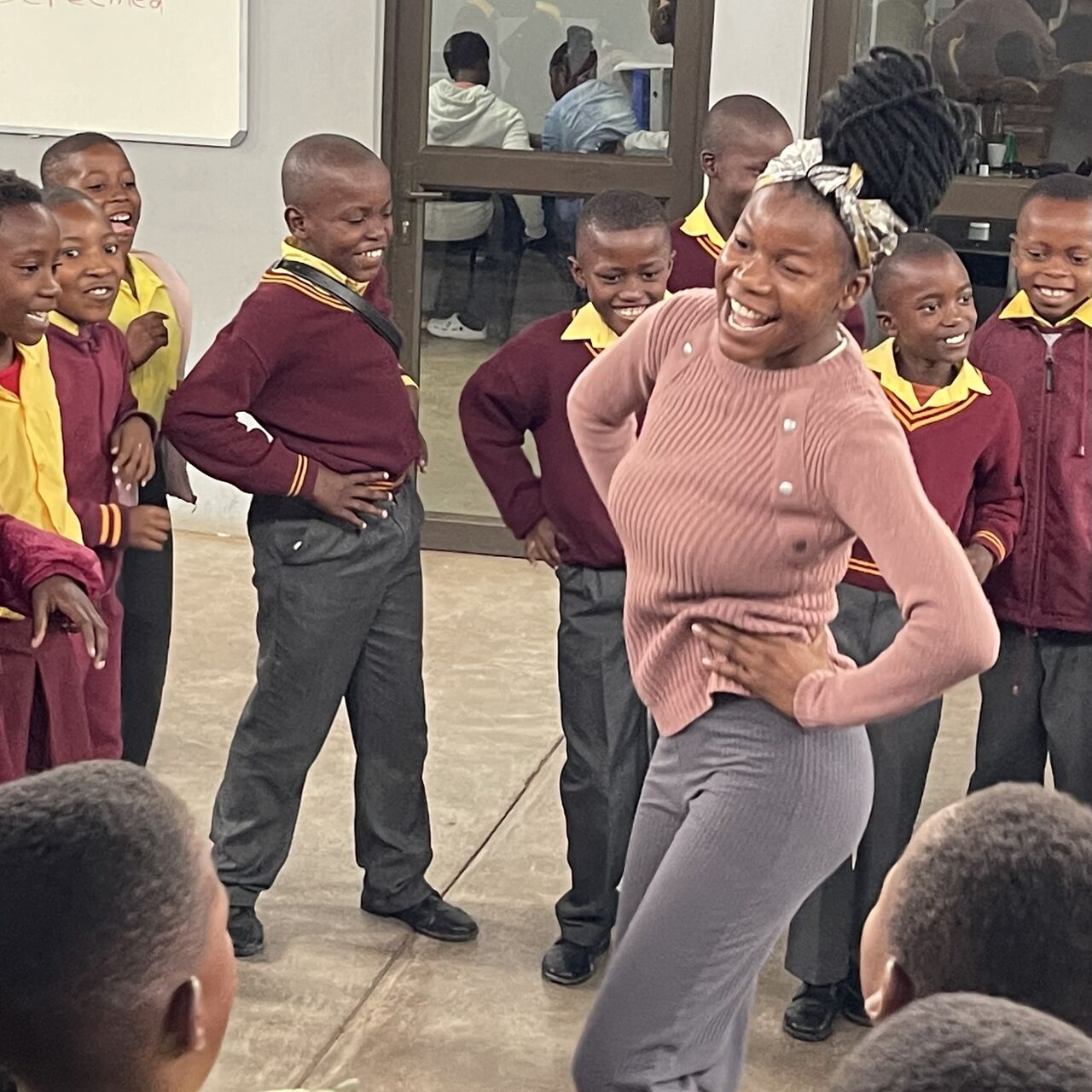 Children and facilitator grooving to the music