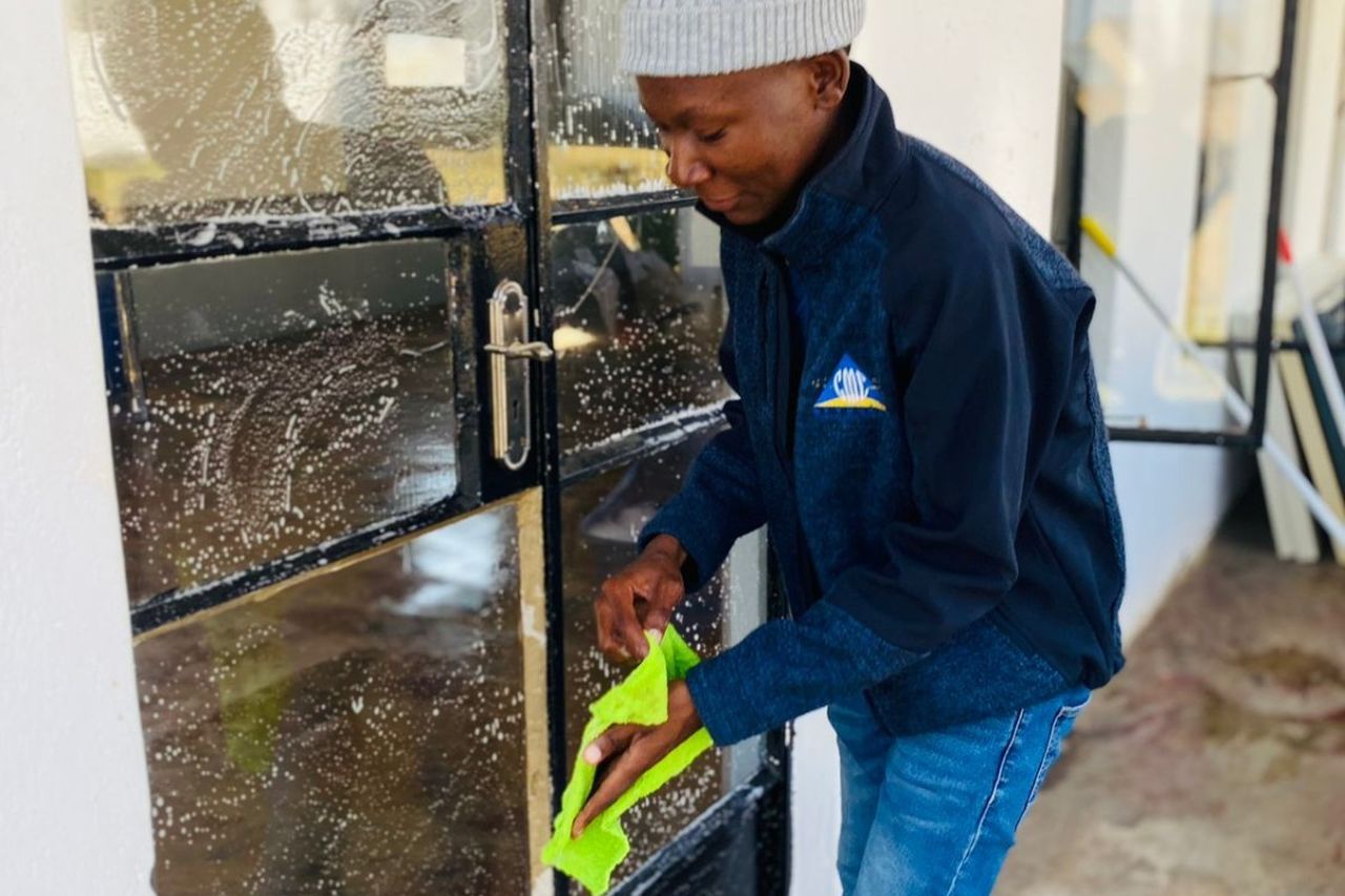 Facilitator Academy students clean learning centre 2